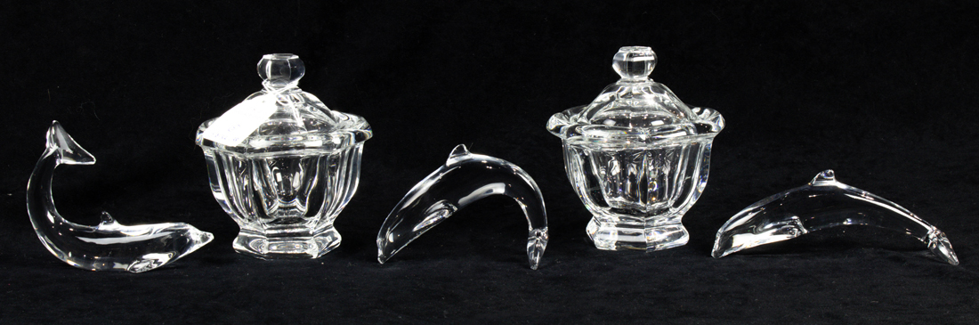 Appraisal: THREE BACCARAT GLASS DOLPHINS AND TWO BACCARAT BRETAGNE COVERED CANDY