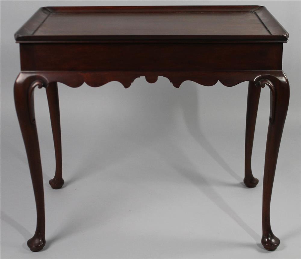 Appraisal: HENKEL HARRIS QUEEN ANNE STYLE MAHOGANY TEA TABLE having a