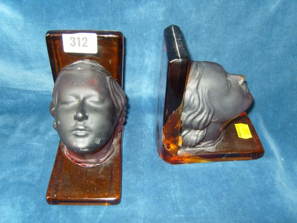 Appraisal: A pair of Art Deco amber glass bookends in the