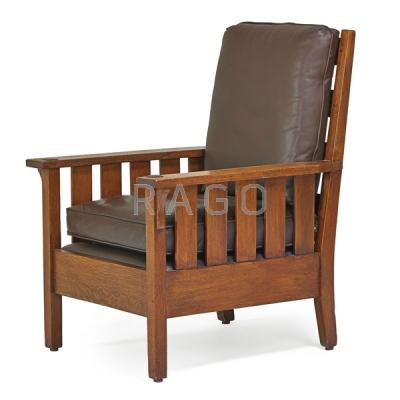 Appraisal: GUSTAV STICKLEY Fixed back armchair Condition Report