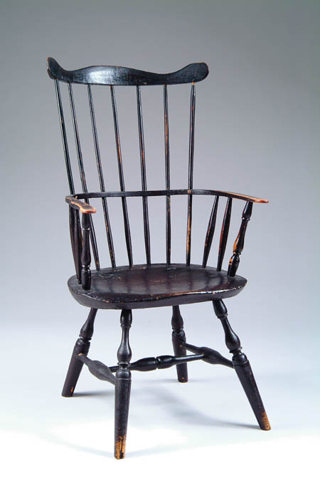 Appraisal: FINE PAINTED COMB BACK WINDSOR ARMCHAIR Seven spindle comb having