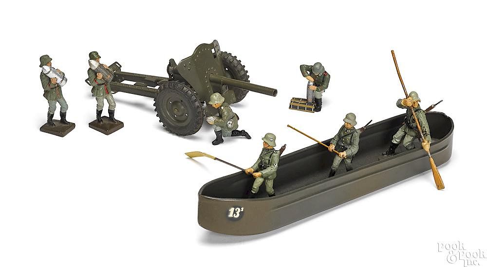 Appraisal: German painted tin pontoon field gun soldiers German painted tin