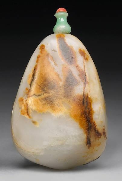 Appraisal: A carved jade snuff bottle Late Qing Republic Period In