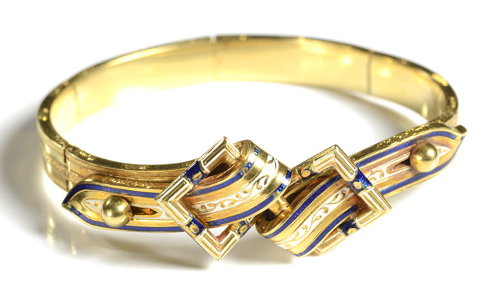 Appraisal: ENAMEL AND TWELVE KARAT GOLD BANGLE The adjustable fit yellow