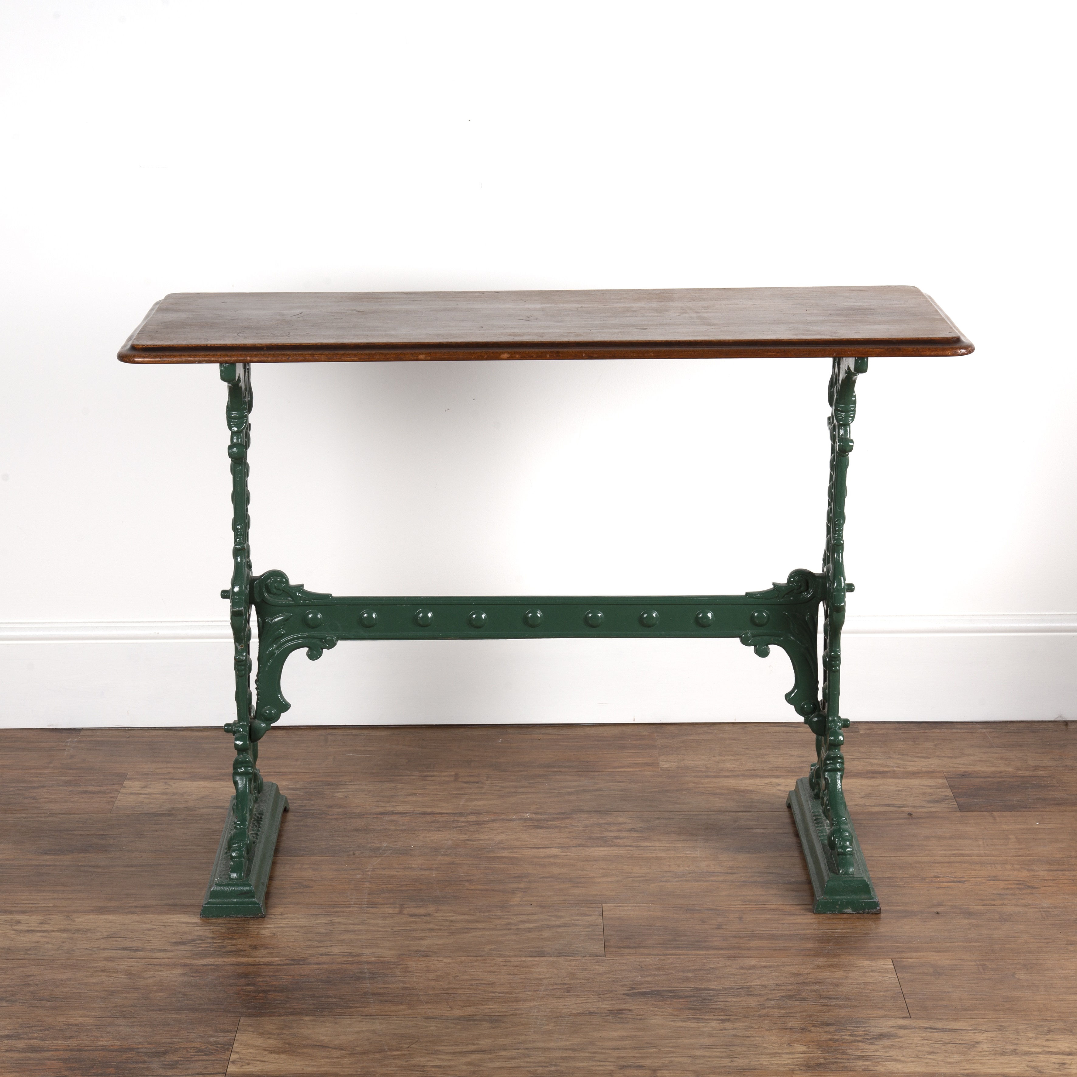 Appraisal: Painted cast iron table base with mahogany rectangular top the