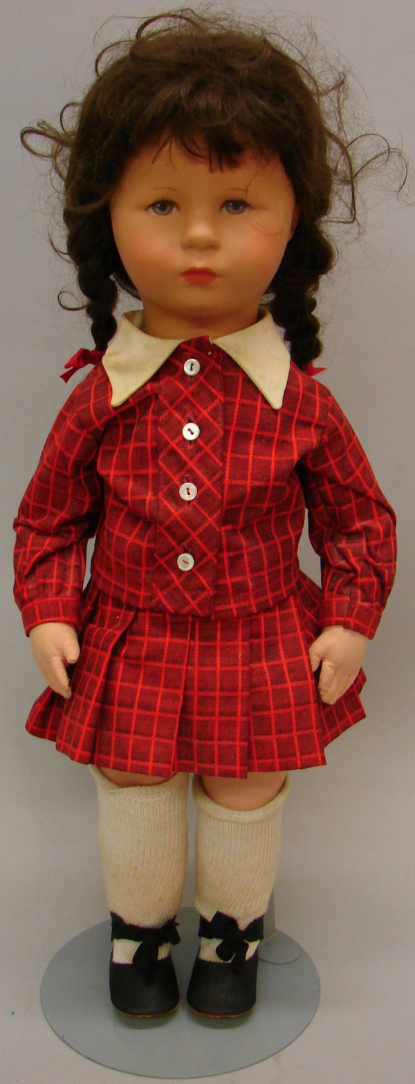 Appraisal: Stofpuppe doll with hard plastic celluloid head and cloth body