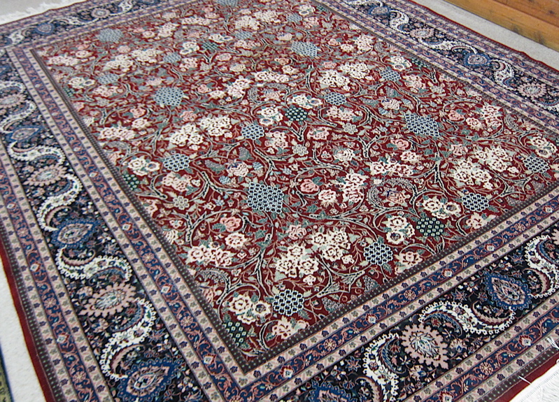 Appraisal: HAND KNOTTED ORIENTAL CARPET Indo-Persian overall floral decoration on red