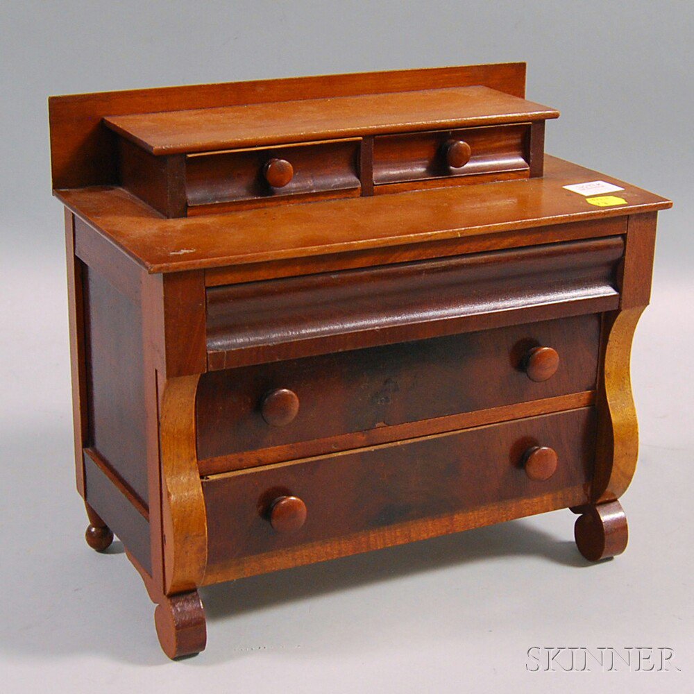 Appraisal: Miniature Classical-style Mixed Wood Chest of Drawers with two short