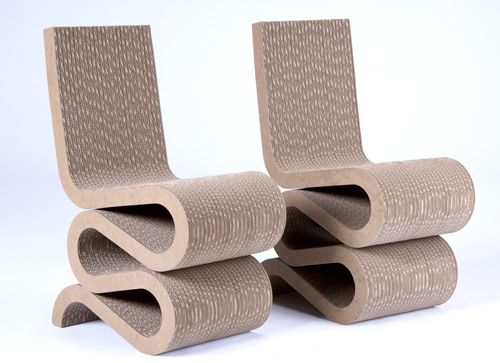 Appraisal: FRANK GEHRY Pair of laminated cardboard Wiggle side chairs from