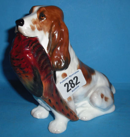 Appraisal: Royal Doulton medium seated Spaniel with Pheasant HN