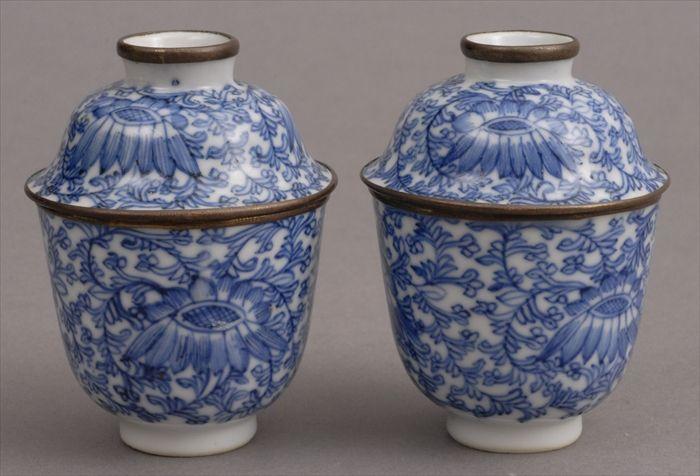 Appraisal: PAIR OF CHINESE BLUE AND WHITE CUPS AND COVERS WITH