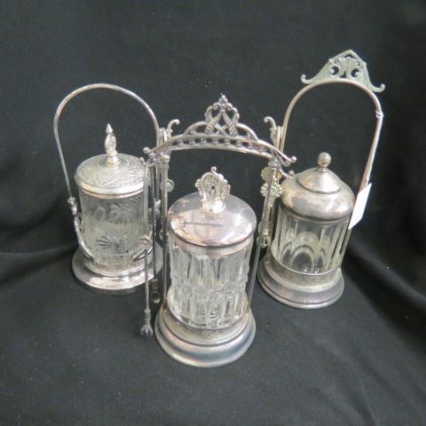 Appraisal: Victorian Pickle Castors pattern glass inserts silverplate holders with tongs