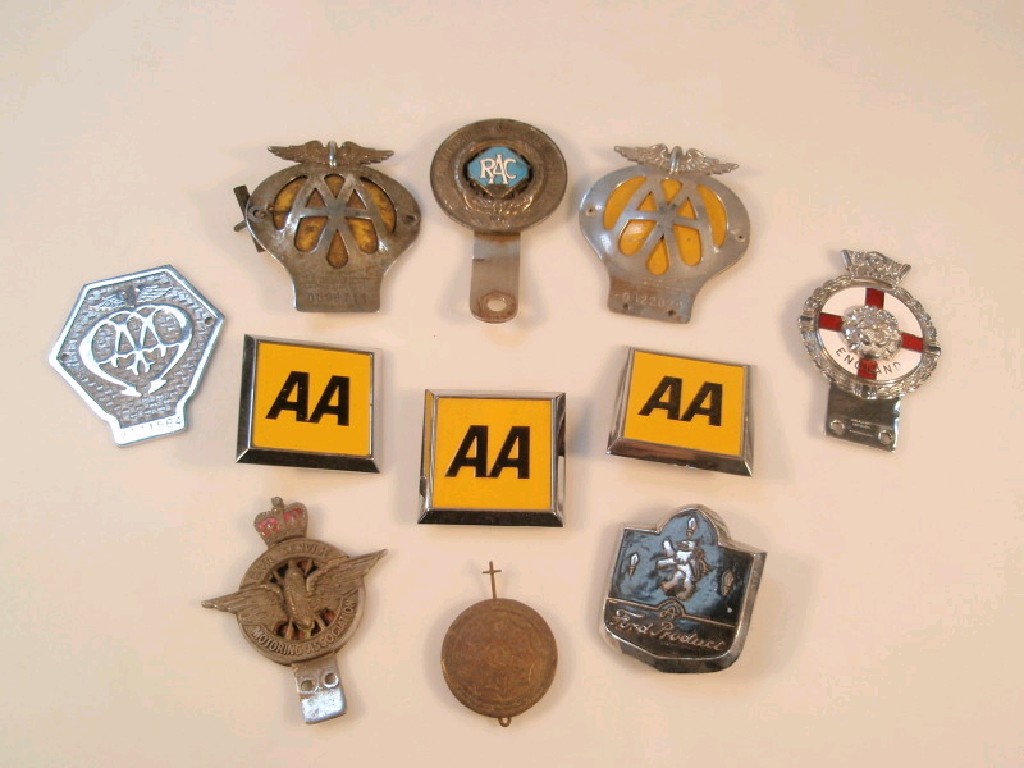 Appraisal: A selection of old AA and RAC car badges together