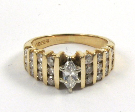 Appraisal: DIAMOND AND FOURTEEN KARAT GOLD RING centering a marquise-cut diamond