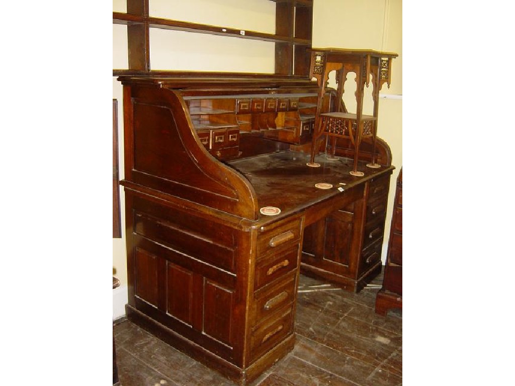 Appraisal: A good quality late Victorian walnut roll top desk the