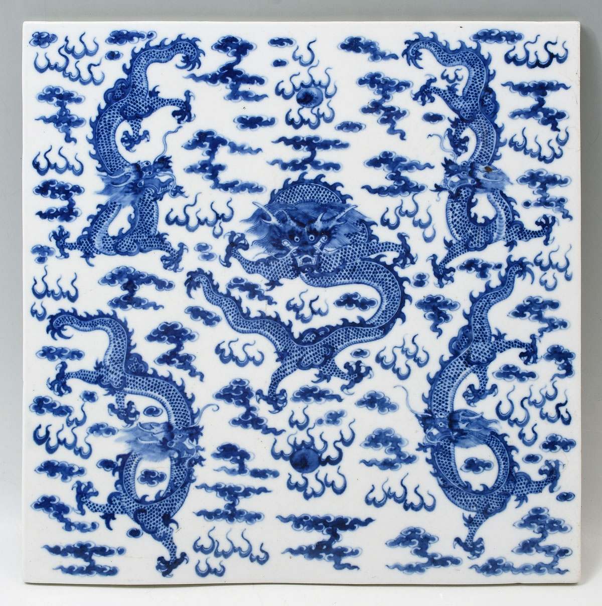 Appraisal: LARGE BLUE WHITE CHINESE PORCELAIN DRAGON PLAQUE Having Dragons amongst