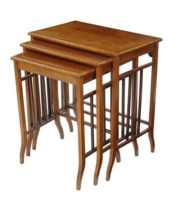 Appraisal: A nest of three mahogany occasional tables satinwood banded and