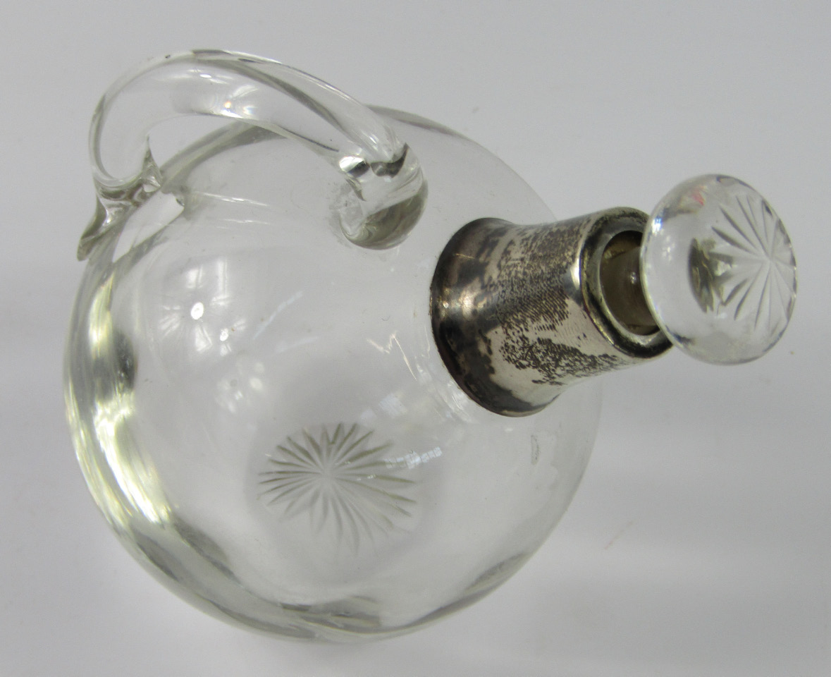 Appraisal: A George V silver and glass perfume bottle the bulbous