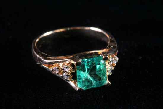 Appraisal: K YELLOW GOLD EMERALD AND DIAMOND RING Emerald-cut emerald weighing