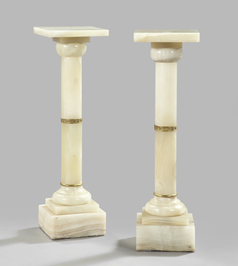 Appraisal: Pair of Italian Brass-Banded White Onyx Columnar Pedestals first quarter