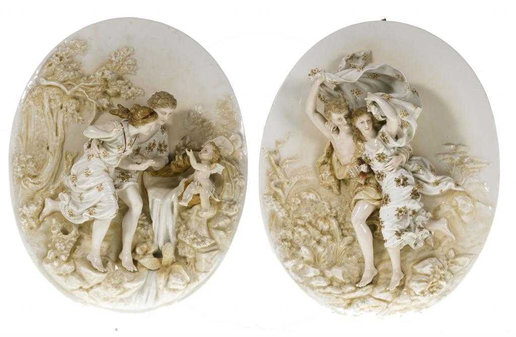 Appraisal: A PAIR OF CONTINENTAL PORCELAIN OVAL PLAQUES modelled in high