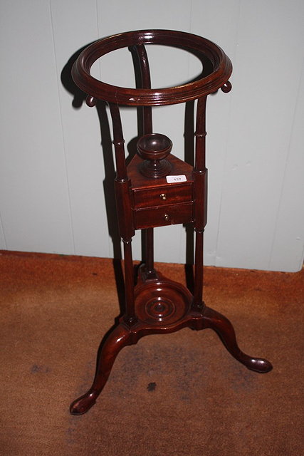 Appraisal: A TH CENTURY MAHOGANY WIG STAND with circular top fitted