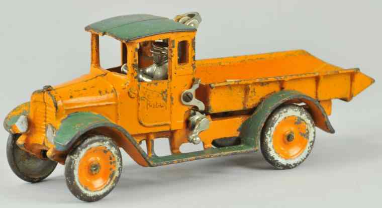 Appraisal: ARCADE YELLOW BABY DUMP TRUCK Scarce example painted in orange