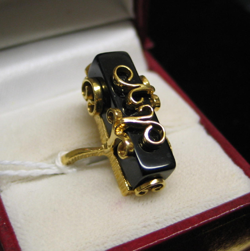 Appraisal: BLACK ONYX AND TEN KARAT GOLD RING set with a