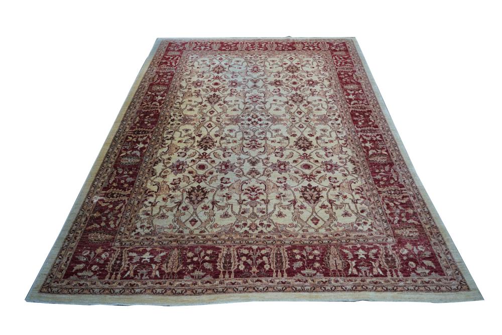 Appraisal: TURKISH RED BEIGE CARPETCondition one side showing sun damage '