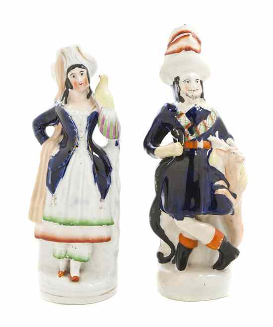 Appraisal: Two Staffordshire Figures the first depicting a gentleman with a