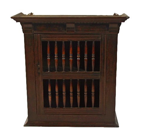 Appraisal: A late th Century oak livery cupboard with moulded cornice