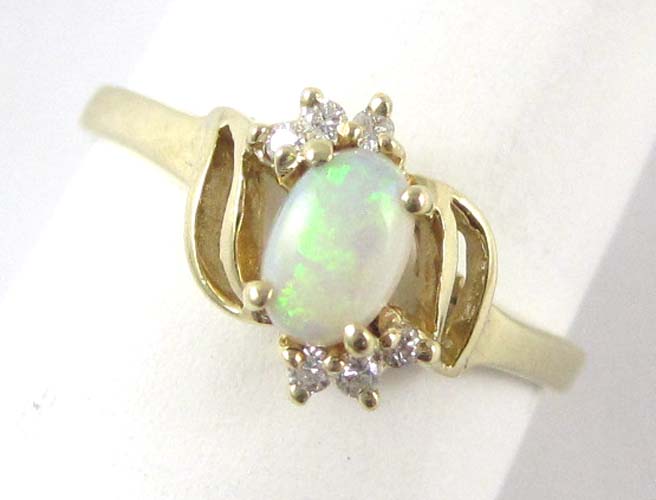 Appraisal: OPAL DIAMOND AND FOURTEEN KARAT GOLD RING with six round-cut