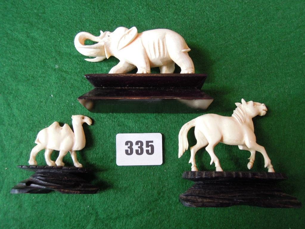 Appraisal: Three carved ivory animals in the form of a horse