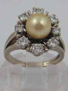 Appraisal: A white metal tests carat gold diamond and cultured pearl