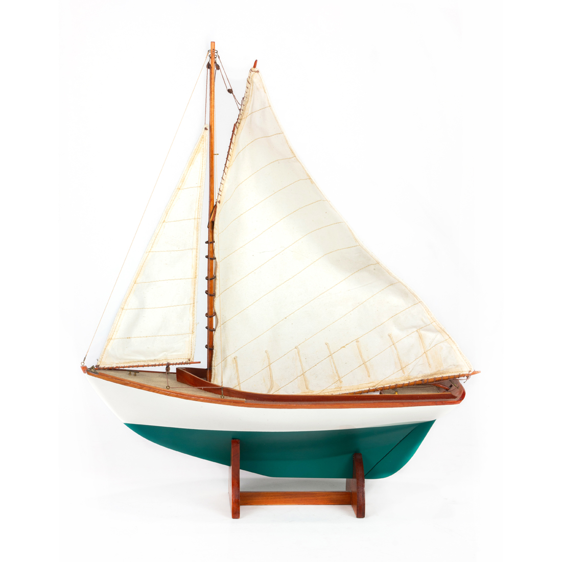 Appraisal: A SCALE MODEL SAILBOAT ON STAND A scale model sailboat