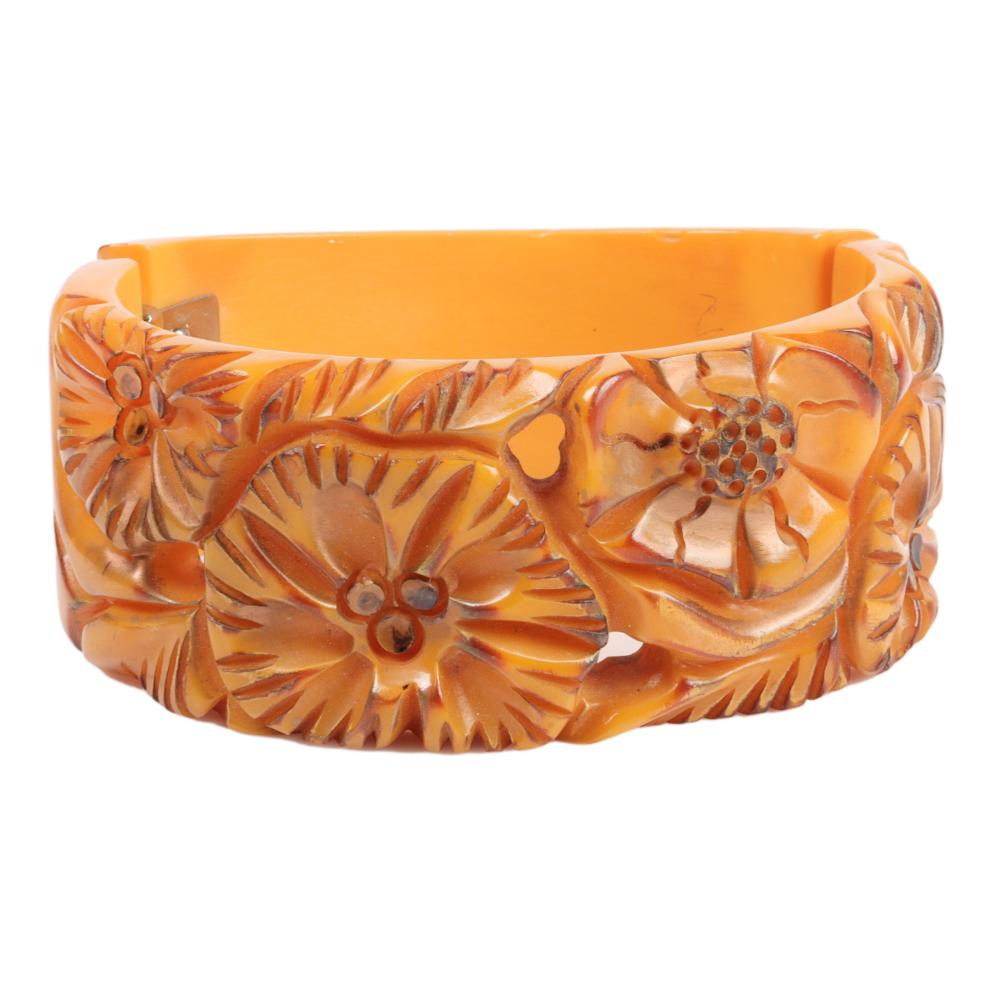 Appraisal: BAKELITE WIDE OVERDYED AND MARBLED BUTTERSCOTCH CLAMPER BRACELET WITH DEEPLY