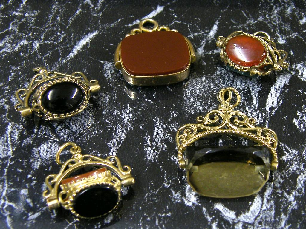 Appraisal: Five assorted ct stone set swivel fob pendants