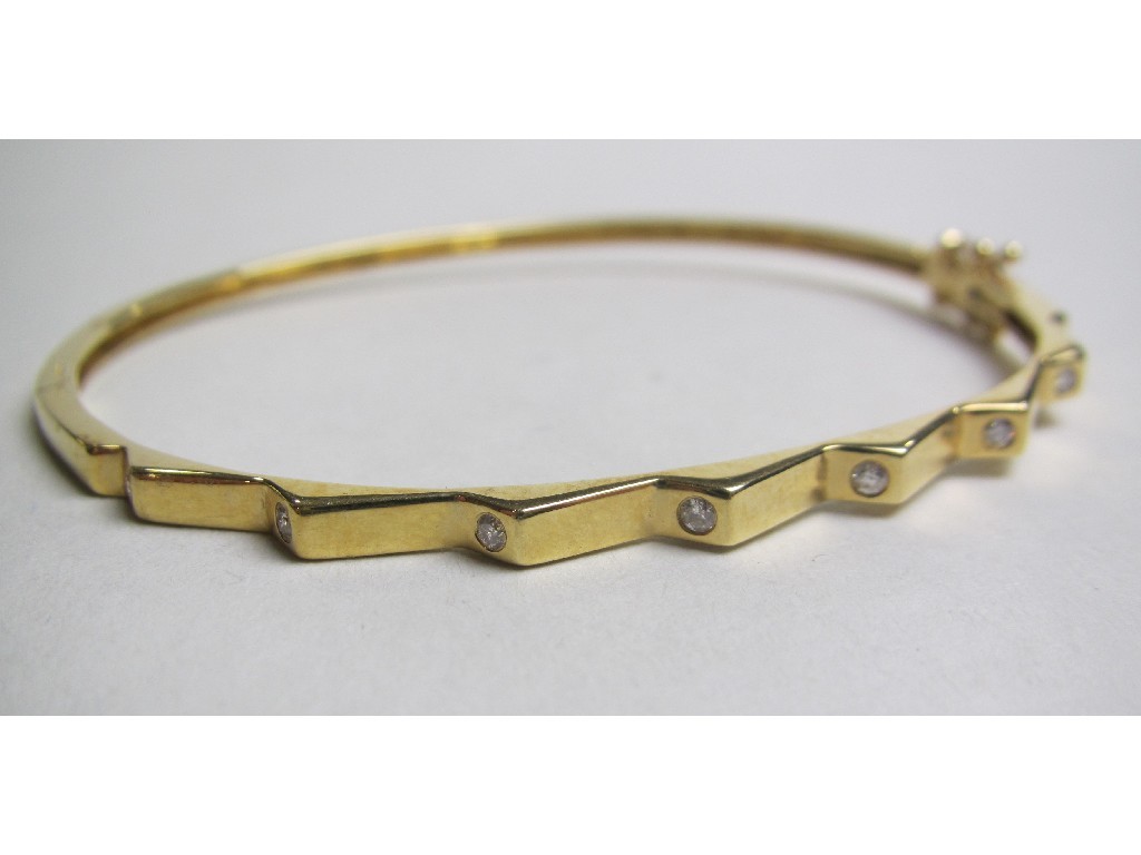 Appraisal: Eighteen carat gold diamond set bangle