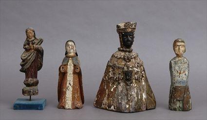 Appraisal: FOUR SPANISH COLONIAL SANTOS FIGURES Comprising a black-face crowned Our