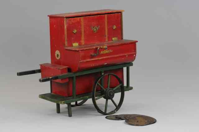 Appraisal: MUSICAL PUSH CART Portable organ grinder with several steel records