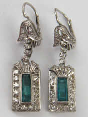 Appraisal: A pair of white metal tests gold emerald and diamond