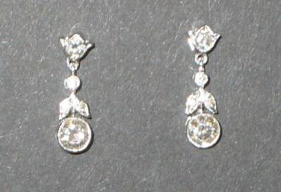 Appraisal: A PAIR OF DIAMOND DROP EARRINGS comprising a brilliant cut