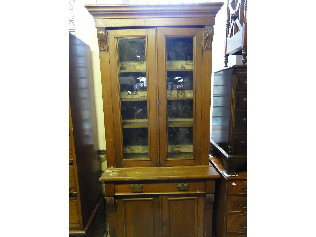 Appraisal: A late Victorian oak library bookcase the upper section enclosed