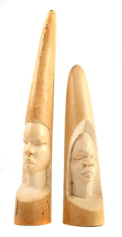 Appraisal: Two old and well-carved African elephant ivory face sculptures Measure