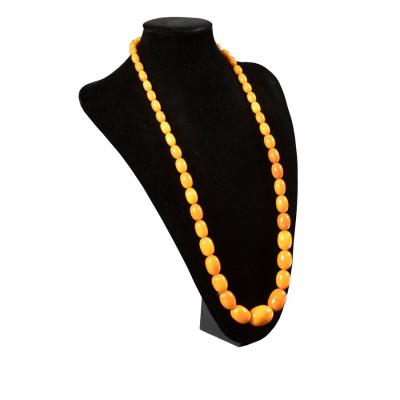 Appraisal: A Baltic amber necklace of graduated oval beads approximately gm