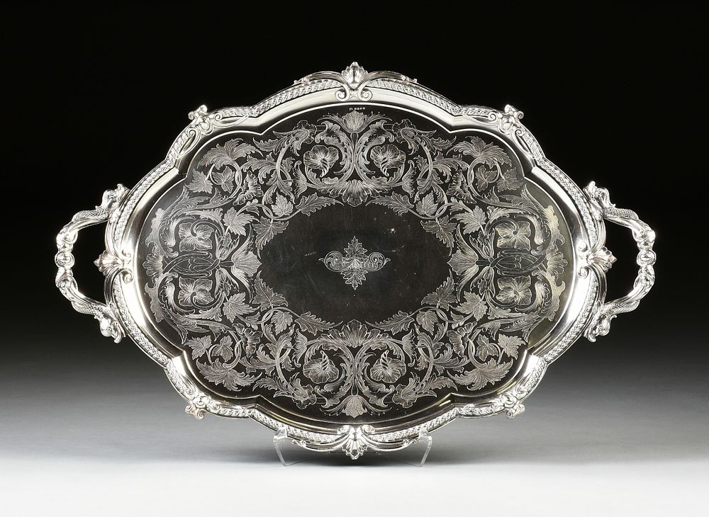 Appraisal: A VICTORIAN SILVERPLATED AND ENGRAVED TWO HANDLED TRAY BY JAMES