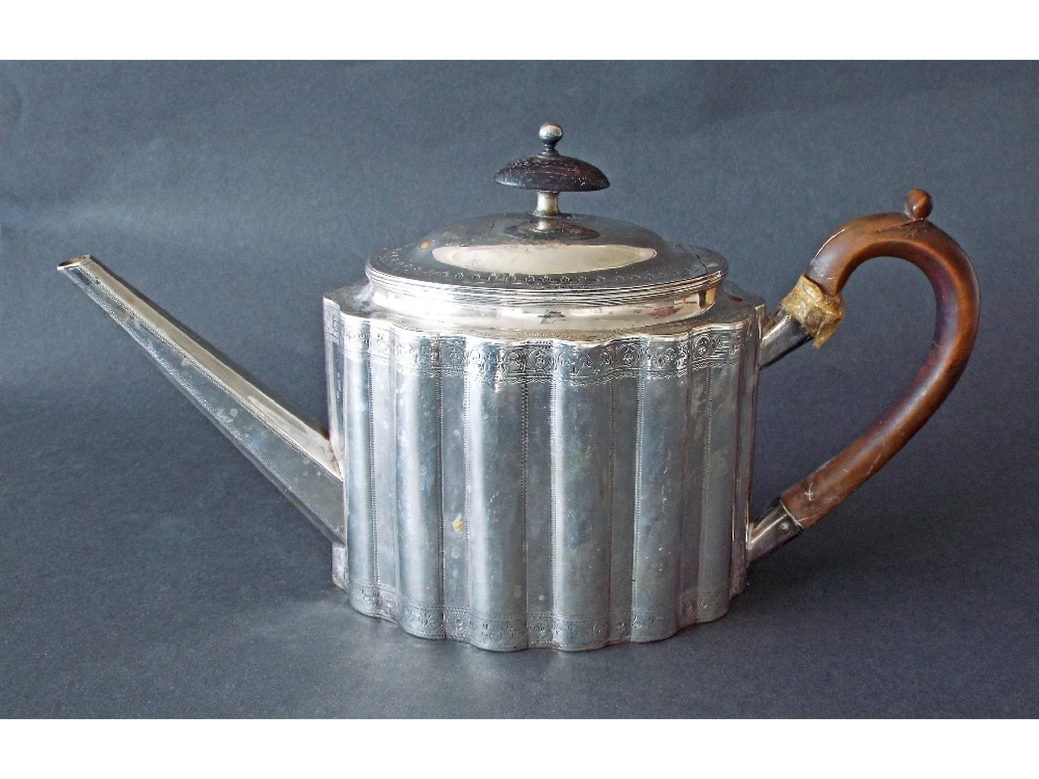 Appraisal: Attractive George III silver teapot of reeded panelled oval form