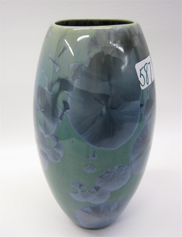 Appraisal: CONTEMPORARY ART POTTERY VASE with iridescent blue decoration on green