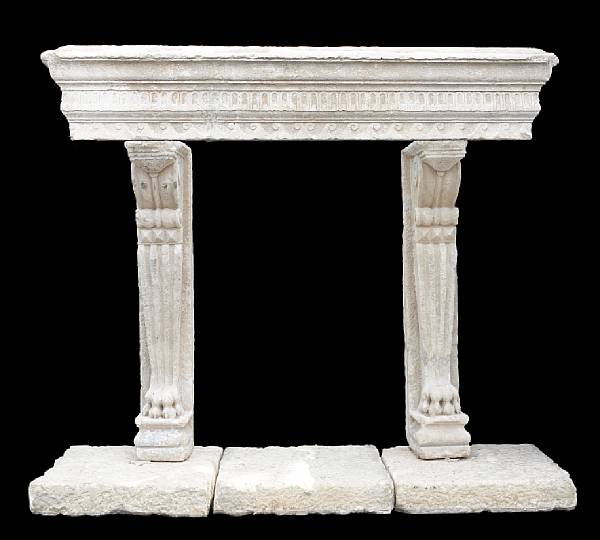 Appraisal: A Baroque limestone fire surround possibly th century The outswept