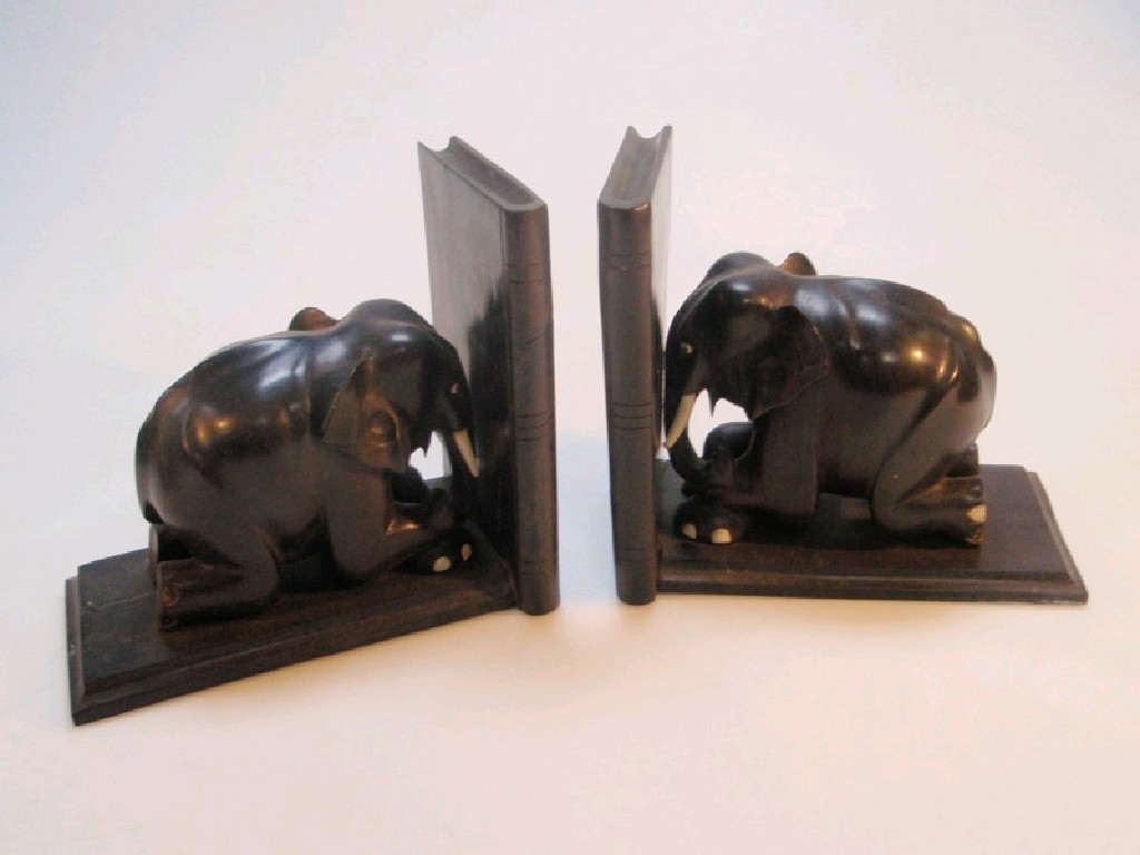 Appraisal: A pair of Indian ebony book ends in the form